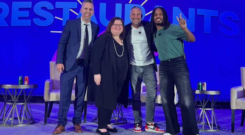 At MEG 2025, from left, panelists Dan Bejmuk, Alice Crowder, Andre Vener, and Keith Lee in front of blue/purple screen onstage at the event 